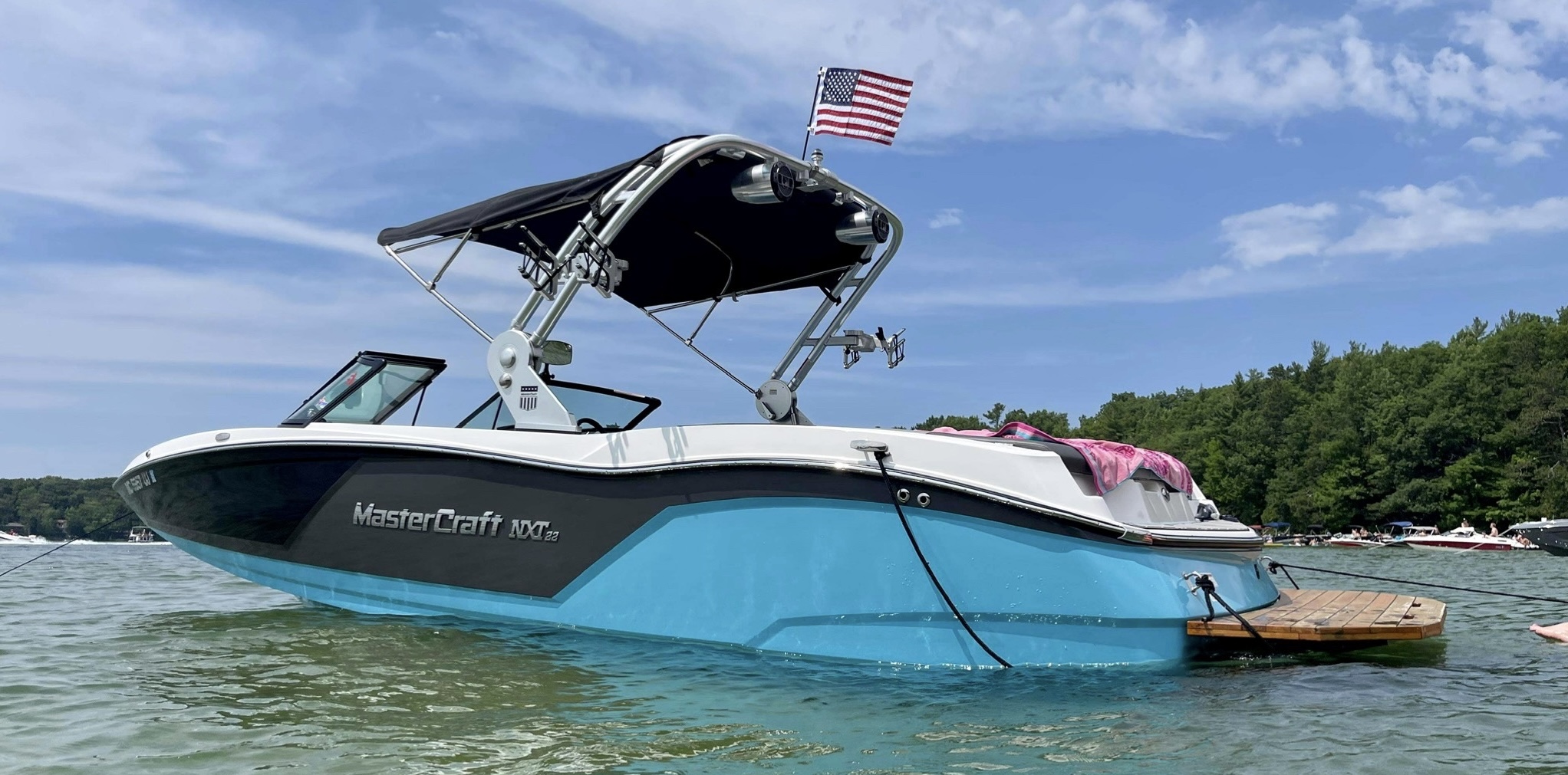 Turquoise MasterCraft boat on the water